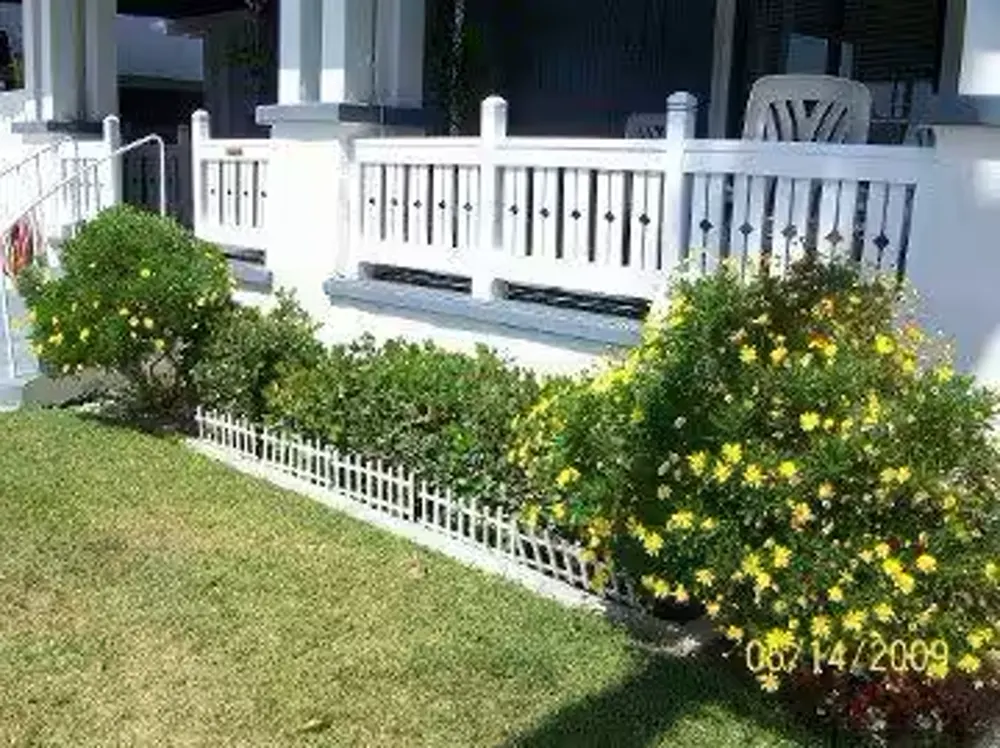 White porch railing installed by CBS Construction Services